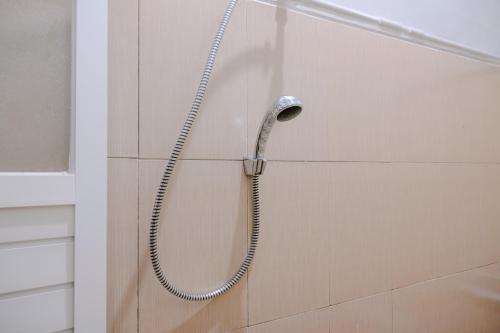 Koupelna v ubytování OYO 2376 Tiara Residence Syariah