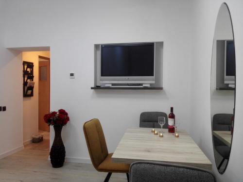 A television and/or entertainment centre at A. Einstein 9A Apartament