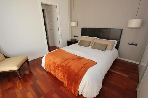 En eller flere senge i et værelse på Apartamento Frente Al Mar