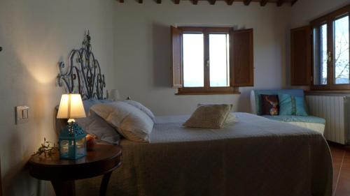 En eller flere senge i et værelse på Agriturismo Colombino