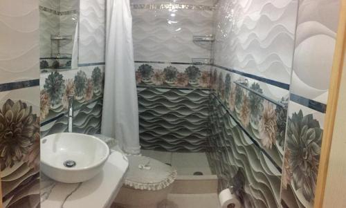 a bathroom with a sink and a toilet and a shower at Cusco Magico 3 - Guest House Santa Ursula in Cusco