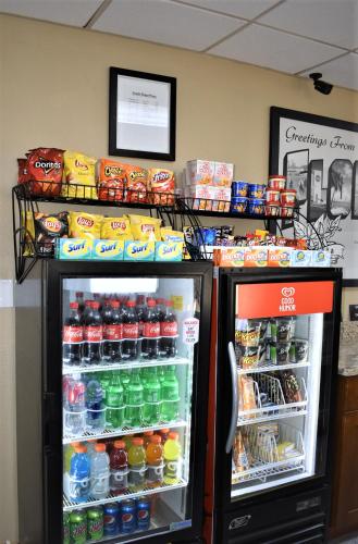a refrigerator filled with lots of drinks and snacks at Super 8 by Wyndham Ocala I-75 in Ocala