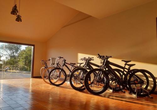 a group of bikes parked in a room at Greenside of Sea in Corujeira