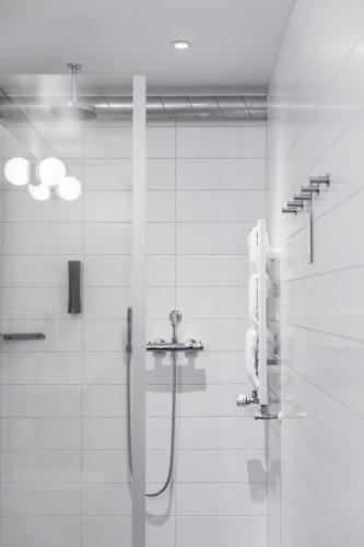 a bathroom with a shower and a sink at Reykjavik Lights Hotel by Keahotels in Reykjavík
