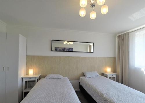 Posteľ alebo postele v izbe v ubytovaní Apartamenty Dobranoc - Wawer 2