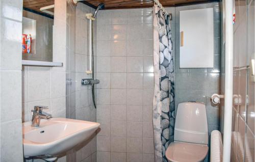 a bathroom with a sink and a toilet and a shower at Lovely Apartment In Rydebck With Kitchen in Rydebäck