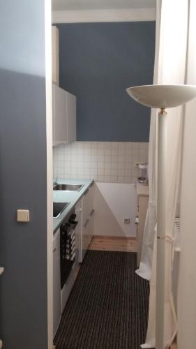 a small kitchen with a sink and a counter at Ruhe des Nordens Appartement in Zittau