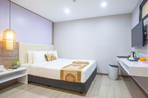 a bedroom with a large bed in a room at Bridge Lakeside Room For Rent Hanoi in Hanoi