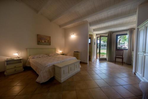 Säng eller sängar i ett rum på Nacalino Agriturismo