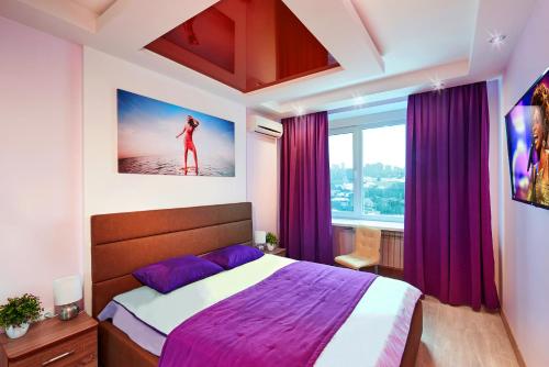 a bedroom with a bed and a large window at Sauna, Big Jacuzzi , Khreshchatyk apartments in Kyiv