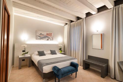 Postel nebo postele na pokoji v ubytování Hotel Fontana Verona