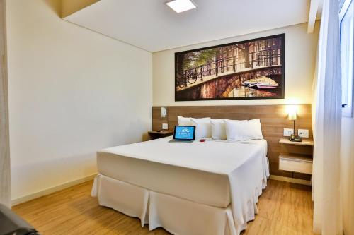 Krevet ili kreveti u jedinici u objektu Hotel Amsterdam Montes Claros