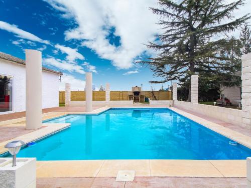 a swimming pool in the backyard of a house at Belvilla by OYO La Casa de Valen in Villamuriel de Cerrato