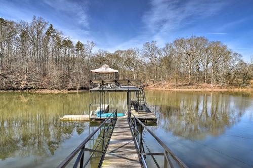 a dock in the middle of a lake at Large Lavonia Home with Party Dock on Lake Hartwell! in Lavonia