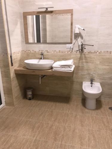 a bathroom with a sink and a toilet at COSTA APARTMENT NAPLES in Naples