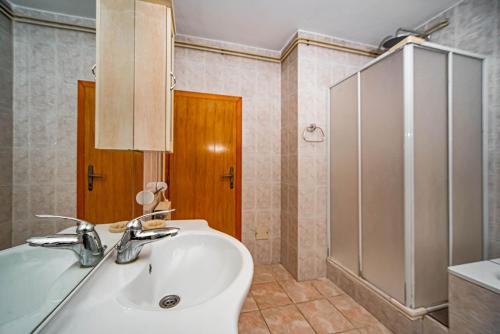 a bathroom with a sink and a shower at Apartments Marković in Kotor