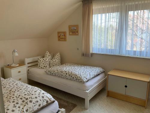 Ein Bett oder Betten in einem Zimmer der Unterkunft Annes Ferienwohnung Freiburg