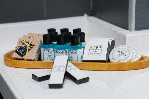a counter with four bottles of hair products on it at Sky Roof Hotel in North Nicosia