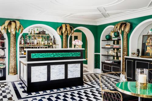 a dressing room with green walls and a mirror at The Prospect Hollywood in Los Angeles