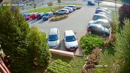 a bunch of cars parked in a parking lot at Ambrózia Étterem és Panzió in Kazincbarcika