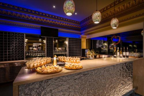 a bar with baskets of food on a counter at Treasury on Collins in Melbourne