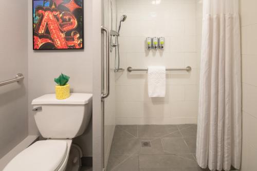 a bathroom with a toilet and a shower at Staypineapple, Hotel FIVE, Downtown Seattle in Seattle