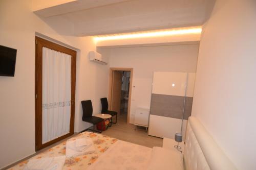 Postel nebo postele na pokoji v ubytování Onda Chiara B&B