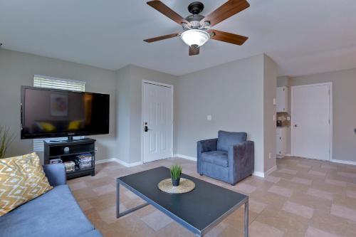 a living room with a couch and a ceiling fan at Ybor Casita! 3-Bedrooms Steps away from Centro Ybor! in Tampa