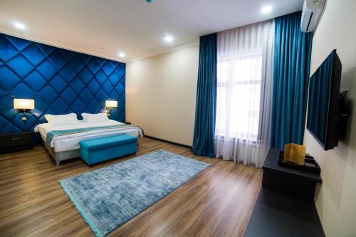Voodi või voodid majutusasutuse Golden Hotel toas