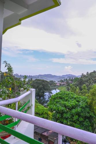 a view of a river from the balcony of a house at Kanchans Nest I Rooms & Suites near Port Blair Airport in Port Blair