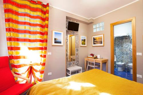 A bed or beds in a room at TerraSole Bakery B&B