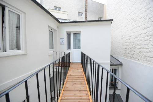 a walkway leading to the second floor of a building at LAFAYETTE HOTEL in Paris