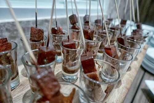 a group of glasses filled with desserts on a table at Mercure Bengkulu in Bengkulu