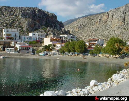 a group of houses on the shore of a body of water at NIKIS SEASIDE HOUSE in Kalymnos