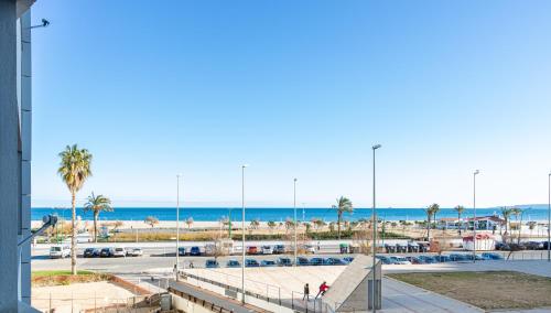 a view of the beach and the ocean from a building at Apart-rent Apartment Cristall Mar 2º 0058 in Empuriabrava