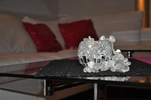 a pair of engagement rings sitting on a table at Comfort Deluxe Kosmos Apartments in Ohrid