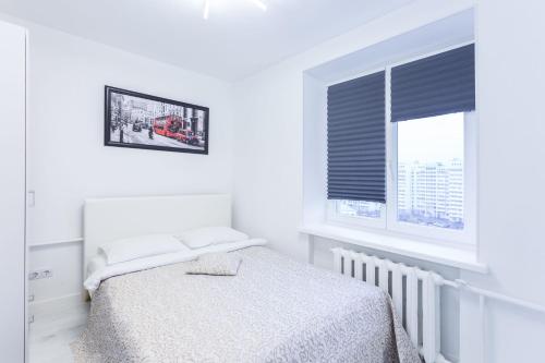Cama o camas de una habitación en Apartments Roomer