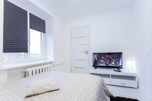 Cama o camas de una habitación en Apartments Roomer