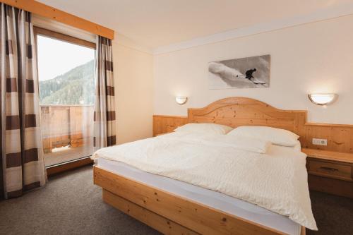 מיטה או מיטות בחדר ב-Apart Pension Moos - inkl Super Sommer Card 2024