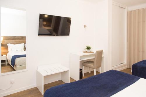 Postel nebo postele na pokoji v ubytování Hotel Veleiro