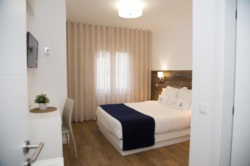 Postel nebo postele na pokoji v ubytování Hotel Veleiro