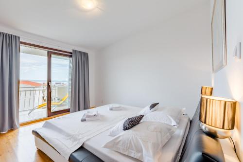 En eller flere senge i et værelse på Apartments Flor de Lis