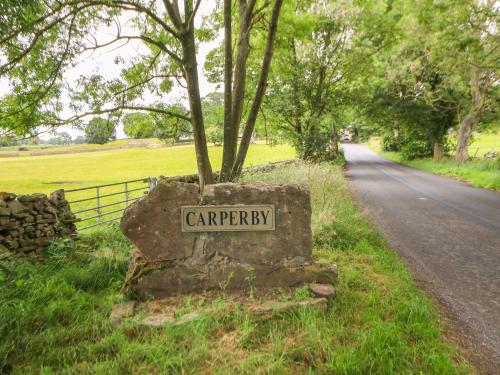 a sign for a cemetery on the side of a road at Barnbrook in Carperby