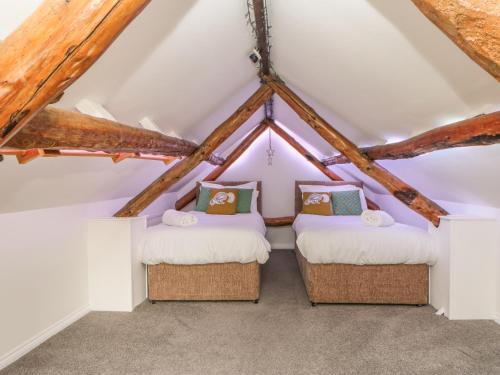 Tempat tidur dalam kamar di Hoodgill Barn