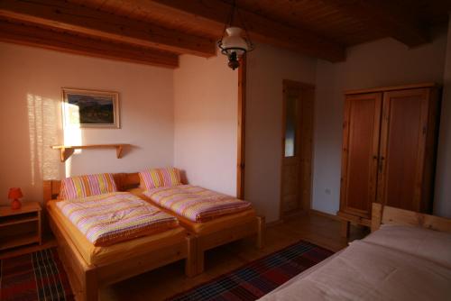 a living room with a couch and a bed at Ubytovanie MARTINKA in Poprad