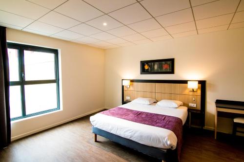 Krevet ili kreveti u jedinici u objektu Tulip Inn Thionville Residences