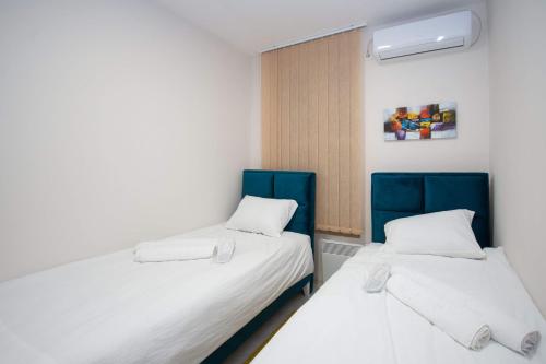 Cama o camas de una habitación en Cvetni trg
