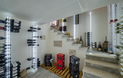 a wine cellar with stairs and wine bottles at Hotel & Spa Bellavista Francischiello in Massa Lubrense