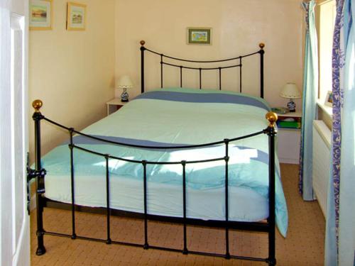 En eller flere senge i et værelse på Trem y Mor