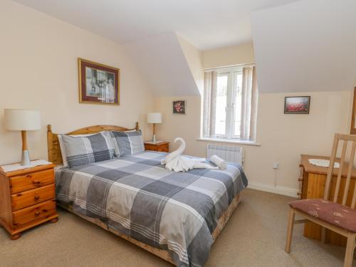 a bedroom with a bed with a swan on it at Whitby Harbour Retreat in Whitby